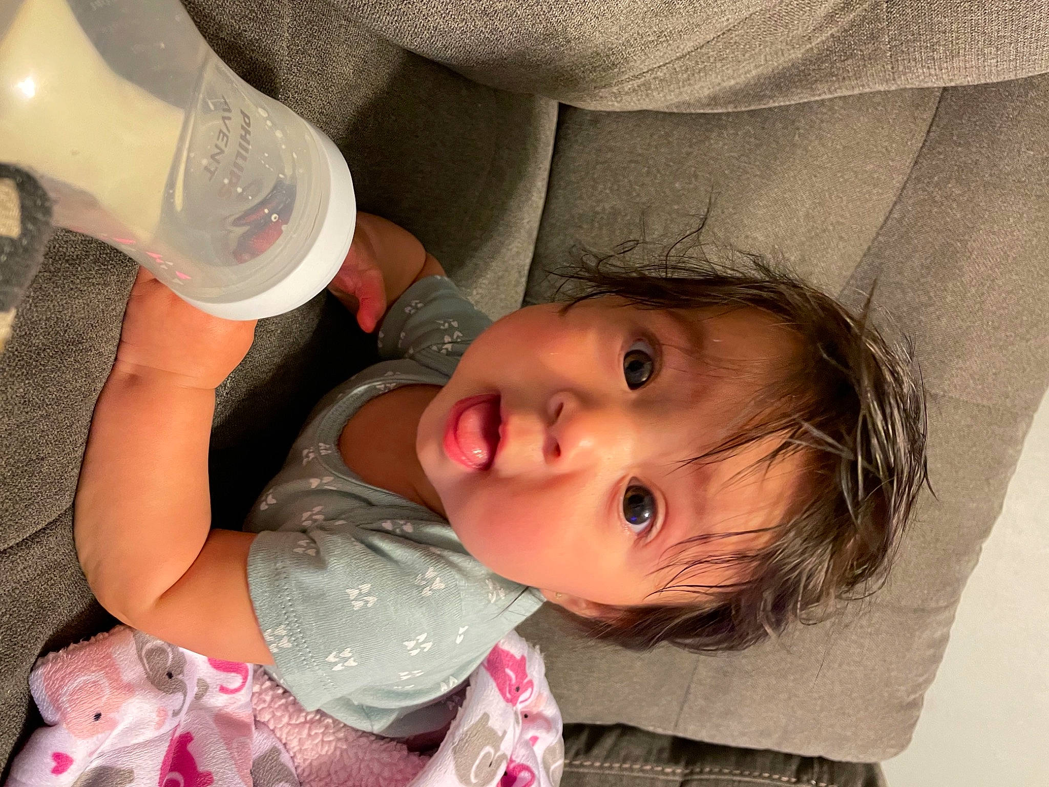 Azariah joined the competition — help win amazing prizes! baby, baby_toddler_clothing, bottle, cheek, comfort, eye, eyelash, face, fluid, hairstyle, human_body, iris, lip, mouth, nose, organ, person, plastic_bottle, skin, surprise