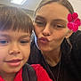 Maverix Ryder joined the competition — help win amazing prizes! child, woman, selfie, indoor, red_shirt, flower, pucker_lips, ceiling, light, portrait, smile, backpack, casual, hair, necklace, face, people, fun, together, happy