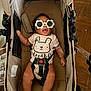 Kiara joined the competition — help win amazing prizes! accessory, adorable, baby, baby_girl, black_hair, child, clothing, cute, floor, indoor, infant, onesie, person, playful, relaxing, seatbelt, smiling, stroller, sunglasses, wooden_floor