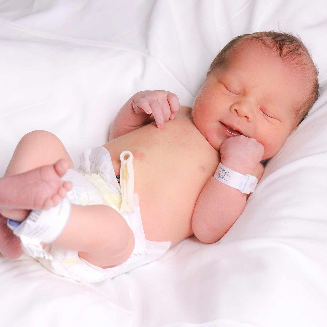 Elijah joined the competition — help win amazing prizes! architecture, baby, bed, blanket, bodypart, building, clothing, diaper, face, finger, furniture, glove, hand, head, hospital, newborn, person, photography, portrait, sleeping