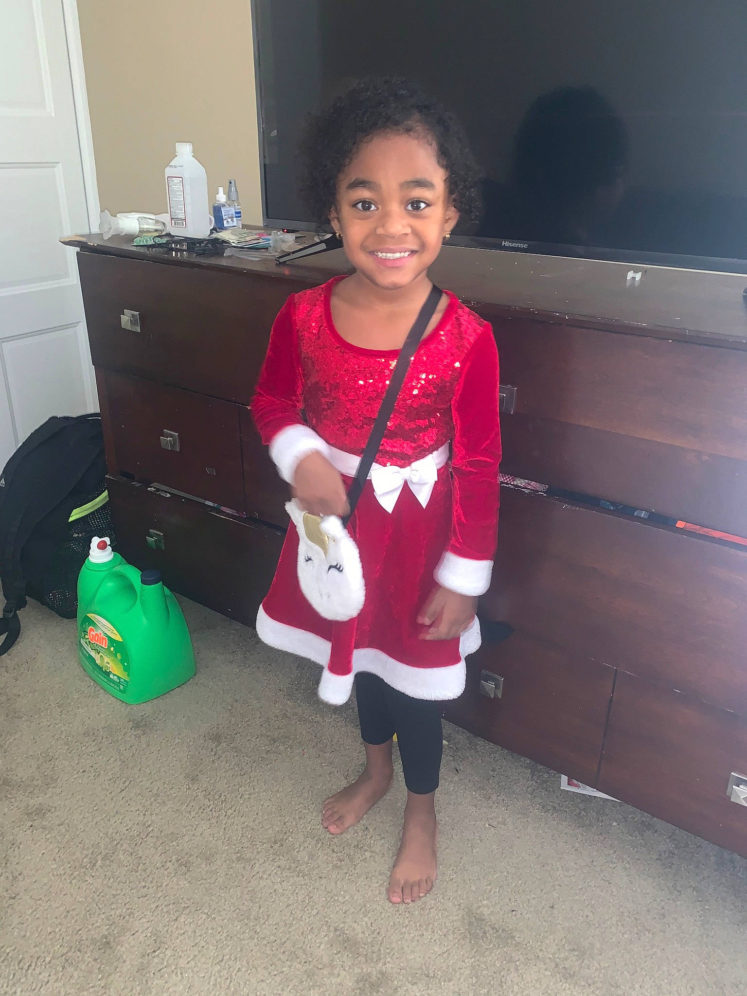 Damiah is registered to the contest to win money with this photo: baby, child, electronic_device, face, footwear, fun, happy, head, holiday, joy, leg, person, play, room, shoe, skin, smile, standing, technology, toddler