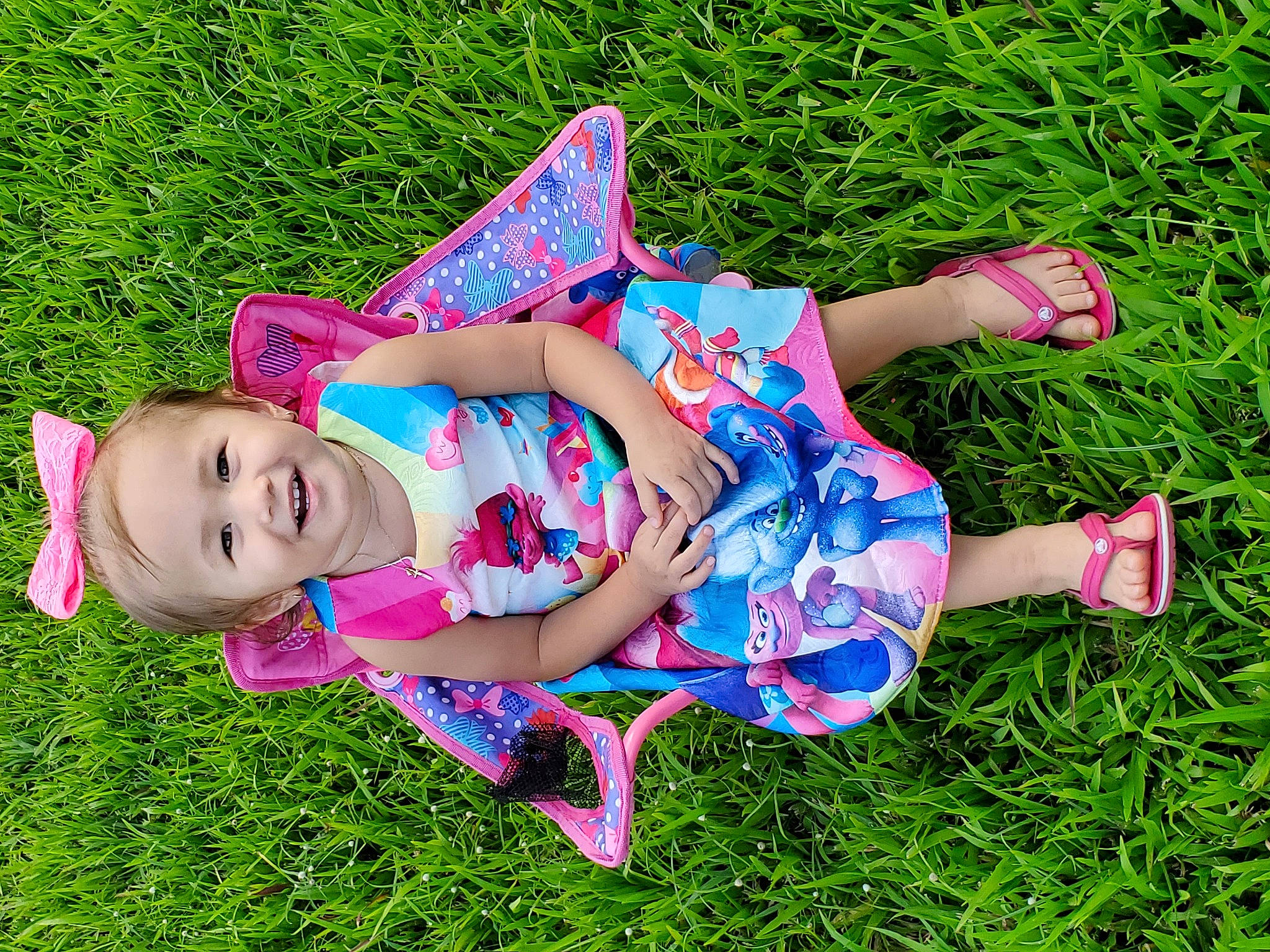 Alazay is registered to the contest to win money with this photo: beauty, child, dress, fun, grass, grass_family, green, happy, joy, lawn, leaf, meadow, pattern, people_in_nature, person, photography, pink, plant, smile, spring