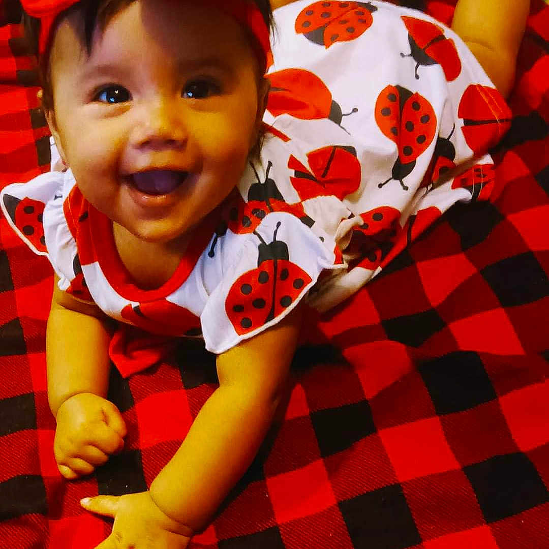 Celestia is registered to the contest to win money with this photo: baby, babycrawling, babylaughing, blanket, cap, clothing, crawling, dress, face, happy, hat, head, homedecor, person, photography, portrait, quilt, shirt, smile, t_shirt