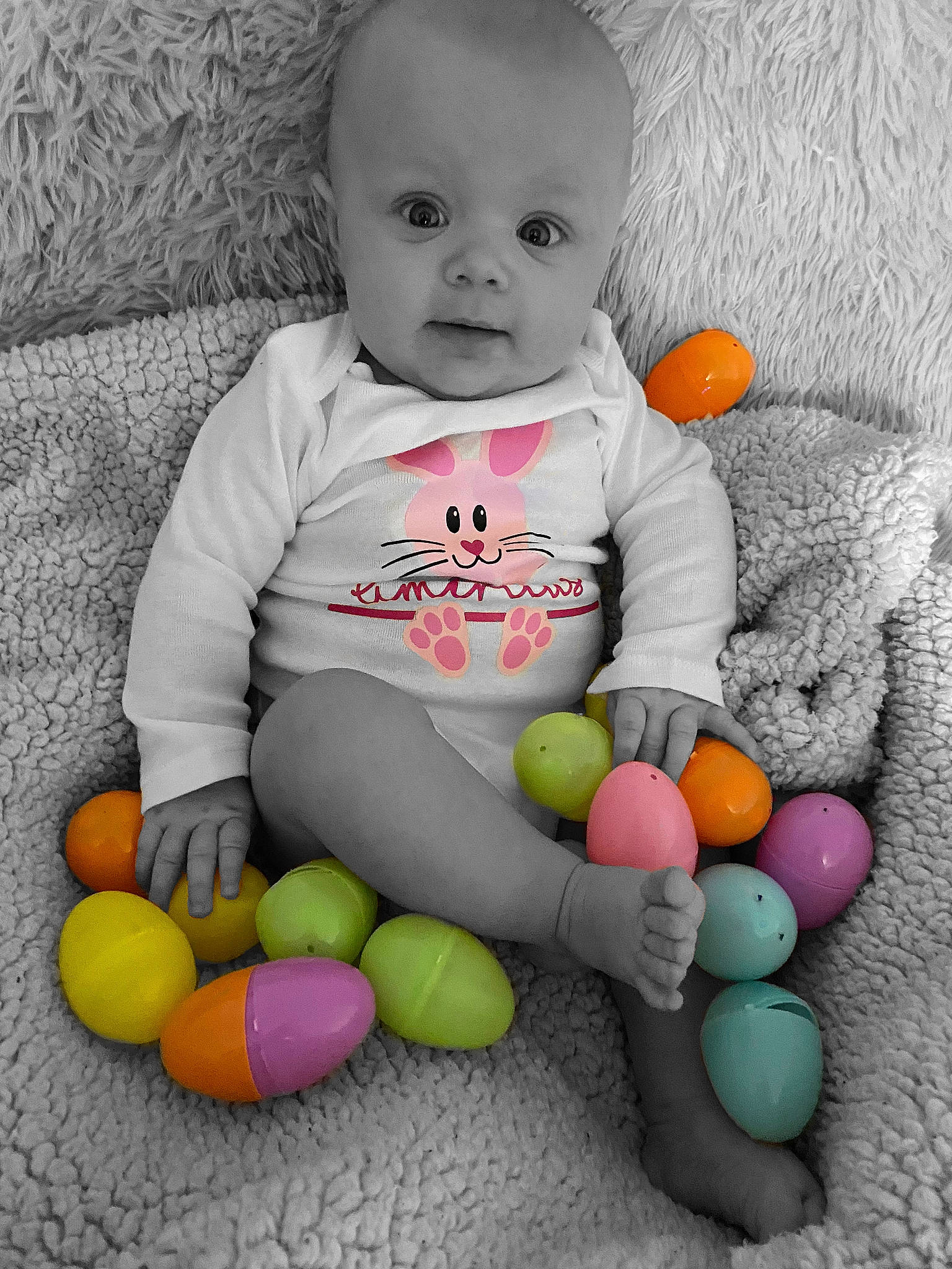 Americus is registered to the contest to win money with this photo: baby, baby_playing_with_toys, baby_toddler_clothing, baby_toys, child, easter, person, play, product, sitting, skin, toddler, toy