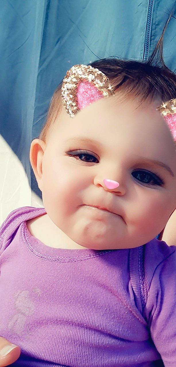 Lovély participe au concours pour gagner de l'argent avec cette photo : baby, baby_toddler_clothing, blue, cheek, chin, clothing, dress, ear, eyebrow, eyelash, happy, headgear, iris, lip, nose, person, pink, plant, purple, skin