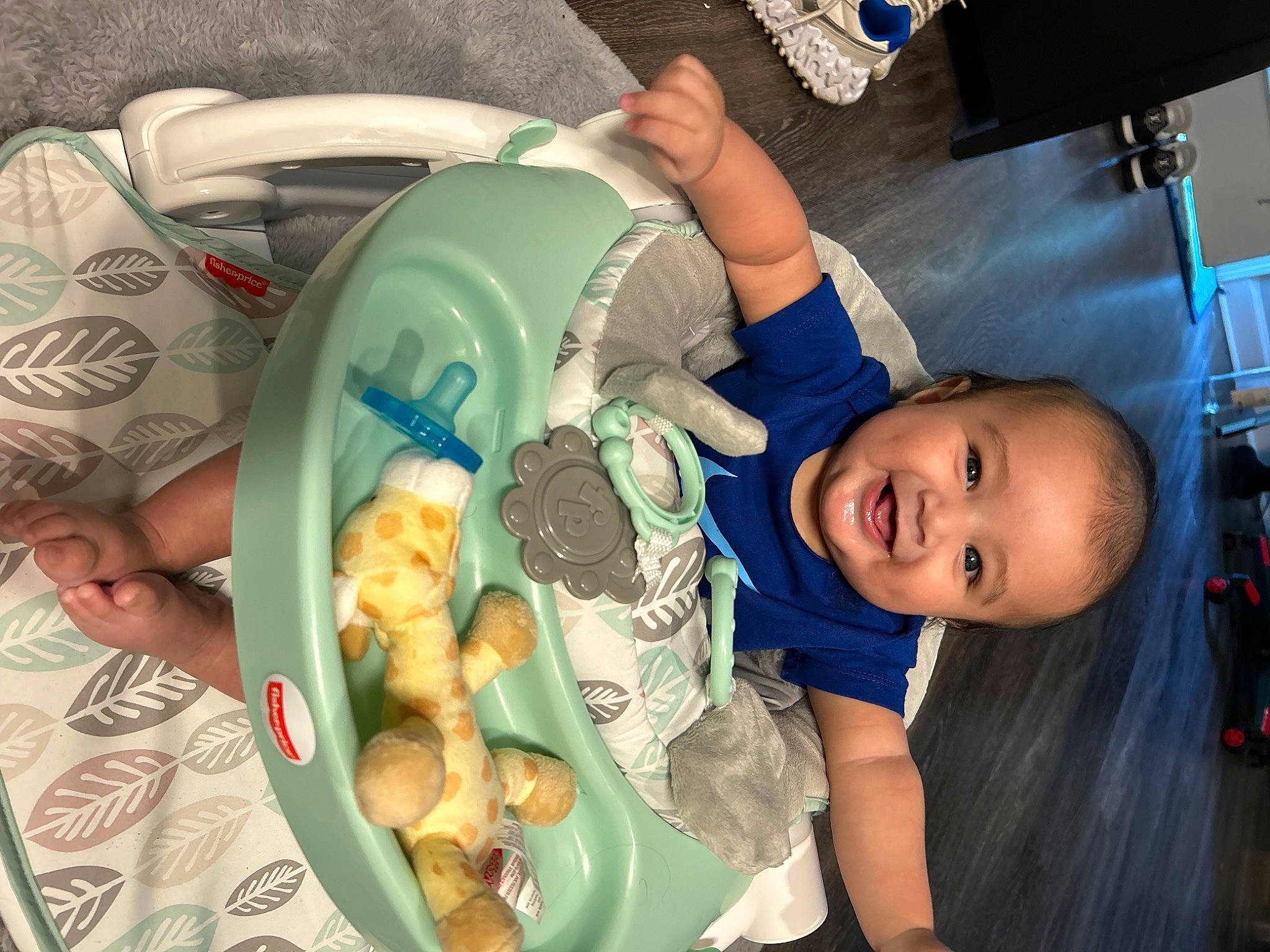 Emiliano is registered to the contest to win money with this photo: arm, baby, baby_products, baby_toddler_clothing, baby_toys, blue, child, comfort, comfort_food, electric_blue, fun, joy, mammal, person, play, room, sitting, smile, stuffed_toy, t_shirt