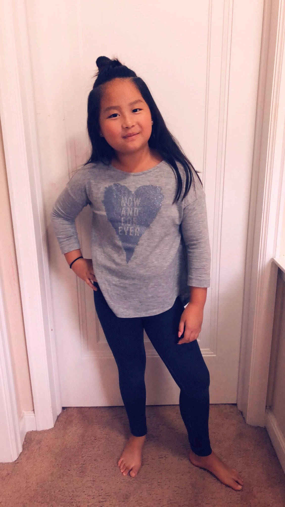 Nevaeh is registered to the contest to win money with this photo: black_hair, blue, child, clothing, denim, footwear, jeans, leg, leggings, long_hair, outerwear, person, shoe, shoulder, sleeve, standing, t_shirt, thigh, tights, toddler
