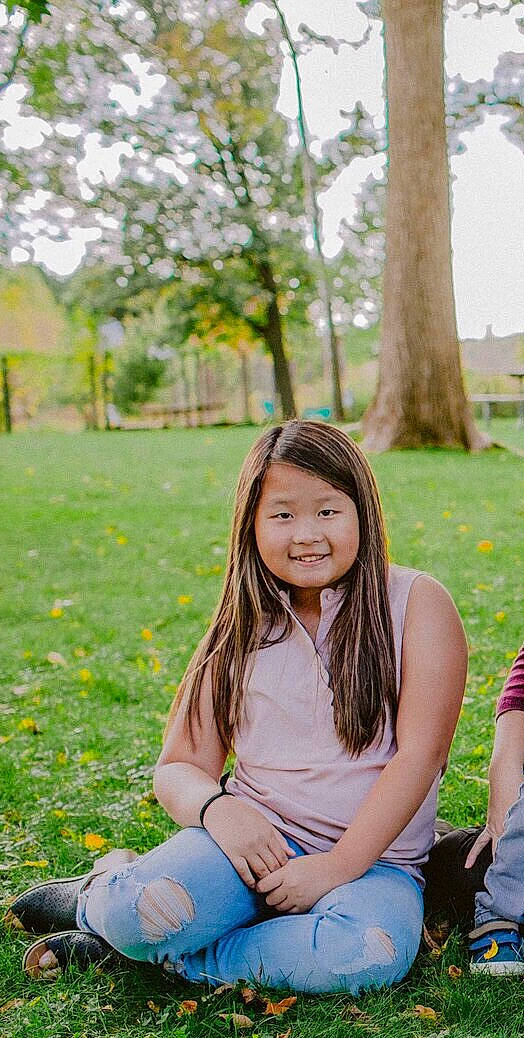 Nevaeh is registered to the contest to win money with this photo: beauty, botany, child, eye, facial_expression, grass, happy, joy, lady, long_hair, people, people_in_nature, person, photograph, photography, sitting, skin, smile, spring, summer