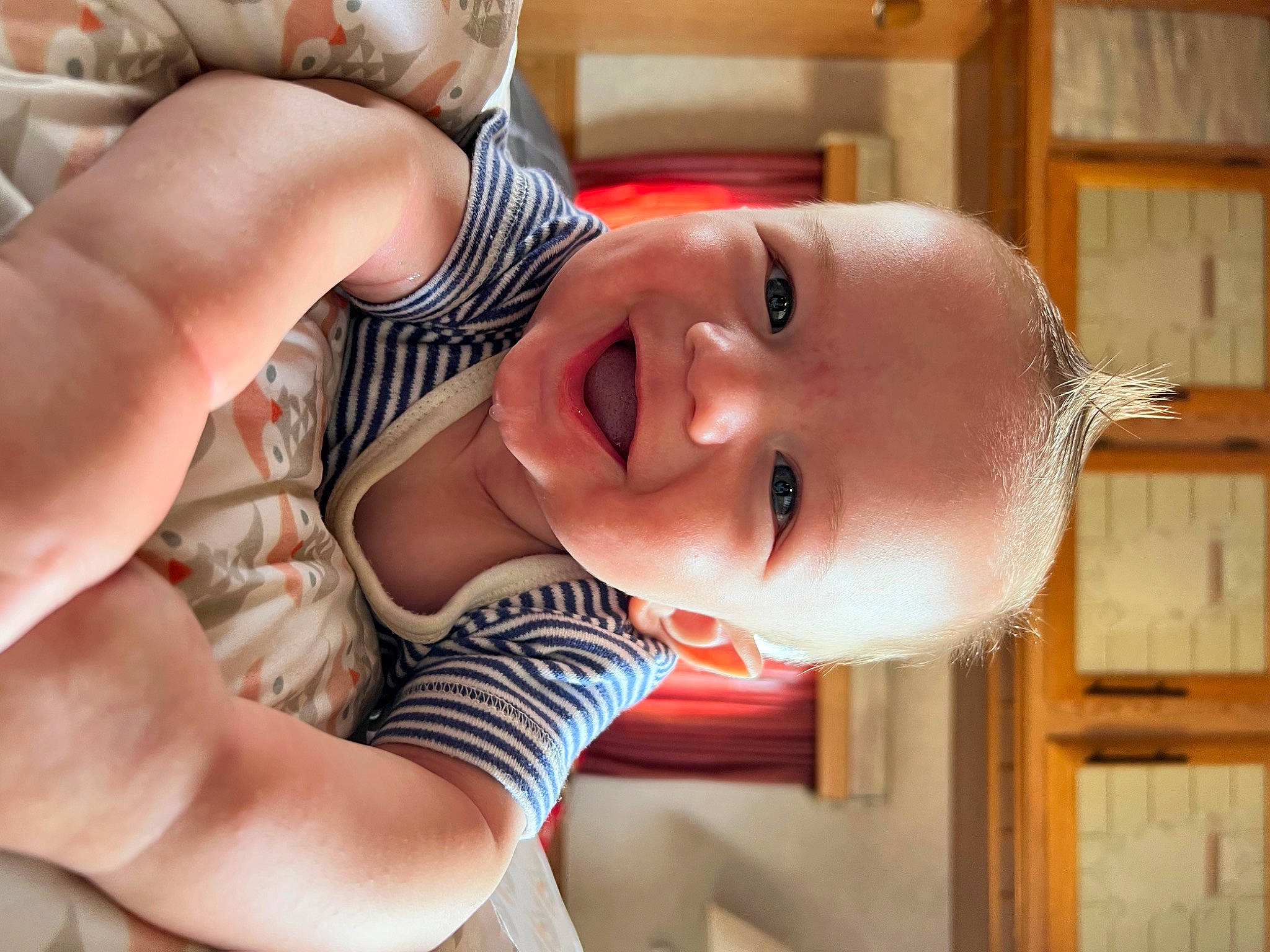 Gregory is registered to the contest to win money with this photo: baby, baby_toddler_clothing, cheek, child, ear, eye, eyelash, facial_expression, finger, gesture, happy, head, joy, lip, mouth, neck, nose, person, skin, smile