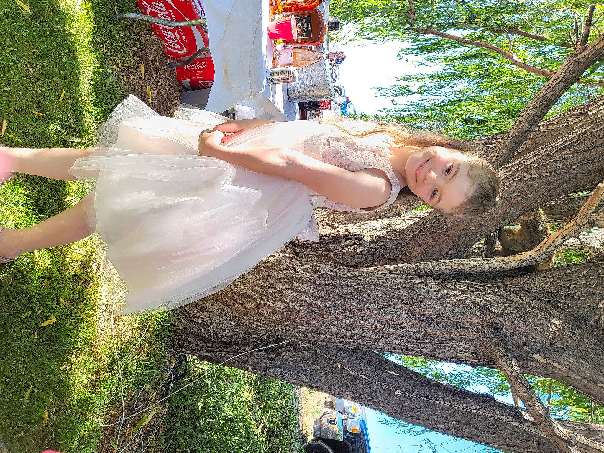 Liliana joined the competition — help win amazing prizes! carbonated_soft_drinks, child, coca_cola, cola, dress, fun, grass, green, happy, human_leg, joy, leisure, people_in_nature, person, plant, tree, trunk, twig, wood, woody_plant