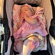 Zhoe joined the competition — help win amazing prizes! baby, stroller, blanket, pink, headband, sock, bow, infant, child, cute, sleepy, clothing, person, toddler, soft, comfort, resting, indoors, closeup, warm