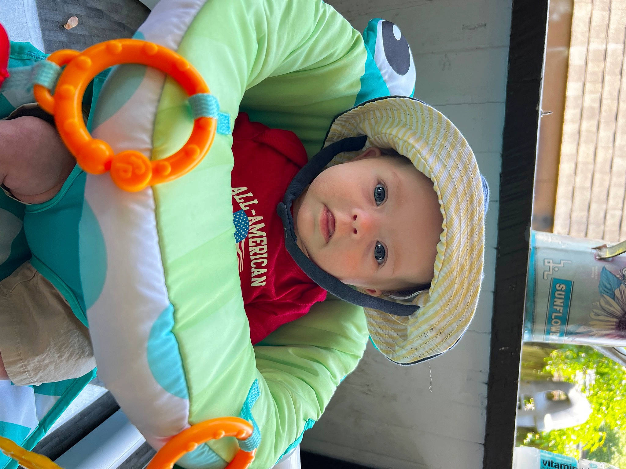 Leland is registered to the contest to win money with this photo: baby, baby_products, baby_toddler_clothing, cap, child, event, fun, green, happy, hat, headgear, headwear, leisure, person, personal_protective_equipment, plastic, play, recreation, room, toddler