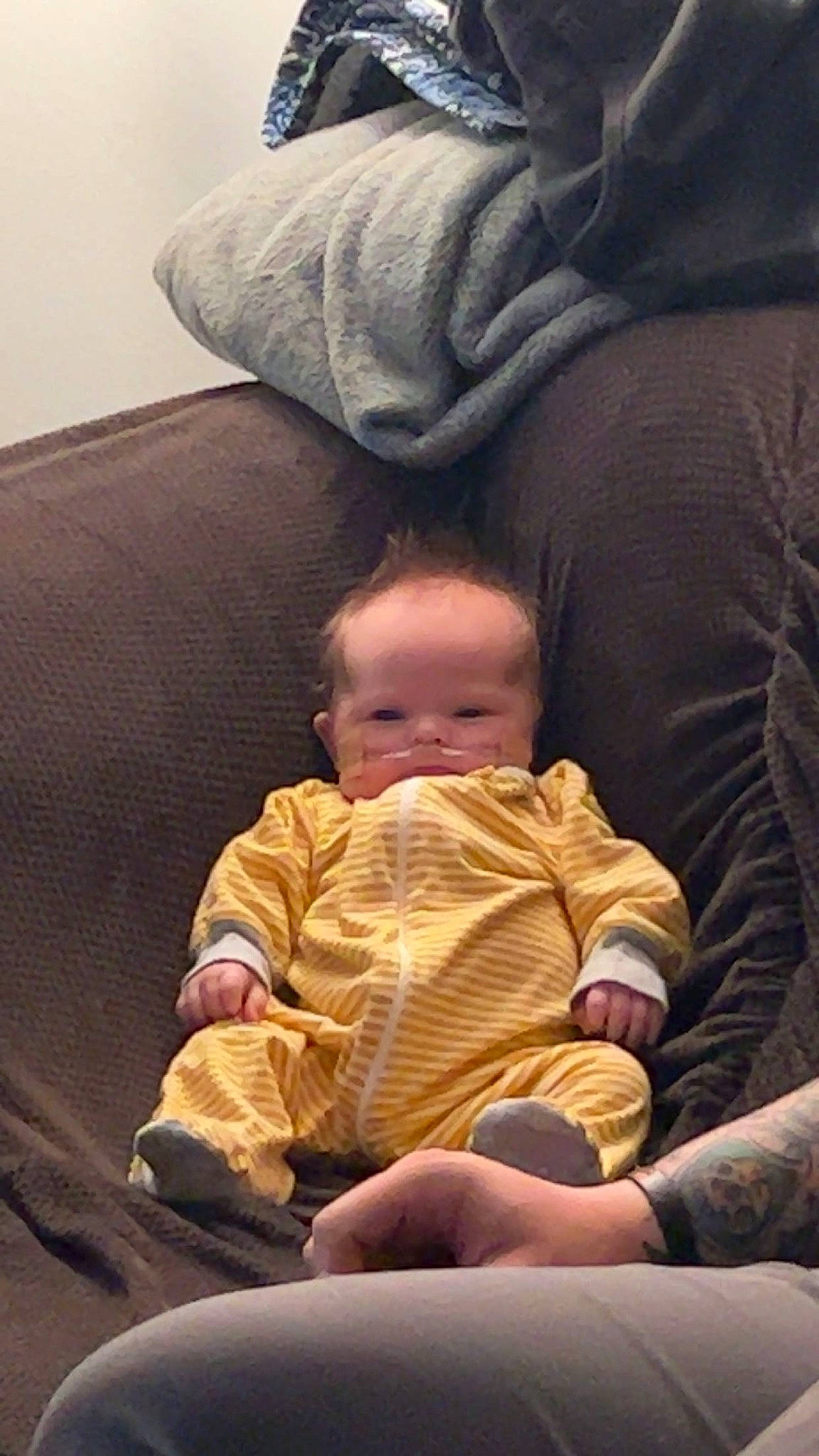 Leland joined the competition — help win amazing prizes! baby, barefoot, cheek, child, comfort, finger, foot, fun, gesture, hand, human_body, human_leg, lap, leg, mouth, person, sitting, skin, thumb, toddler