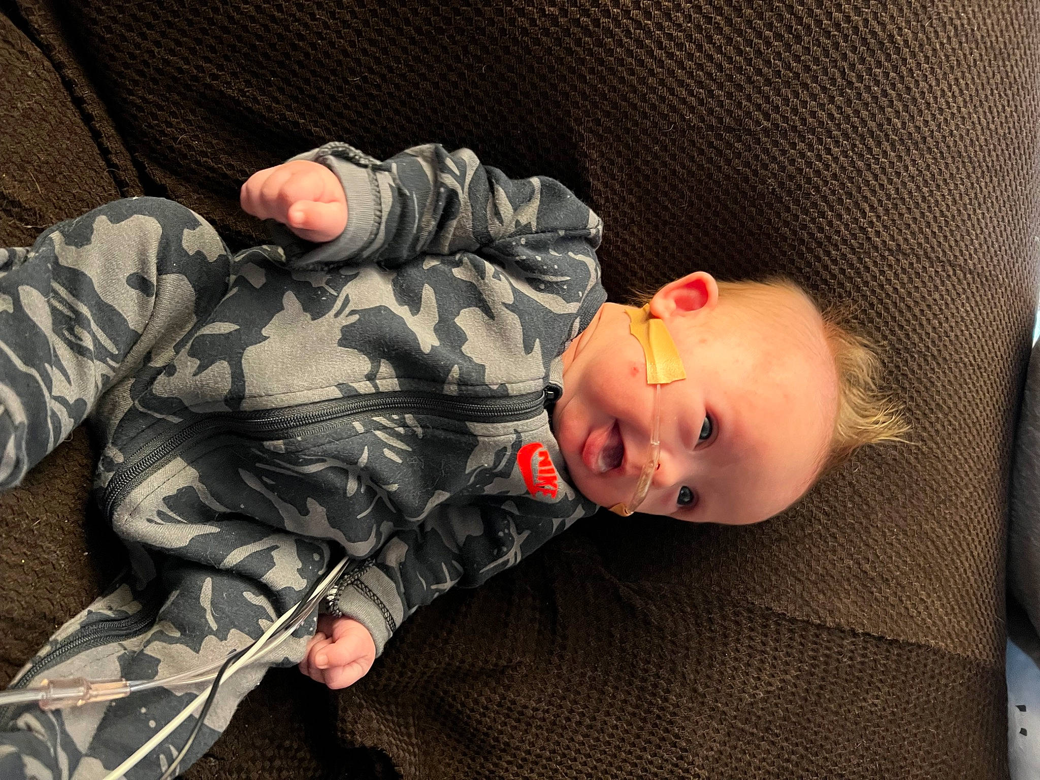 Leland is registered to the contest to win money with this photo: army, baby, baby_toddler_clothing, camouflage, child, comfort, marines, military, military_camouflage, military_organization, military_person, military_uniform, pattern, person, sitting, sleeve, smile, soldier, toddler, uniform