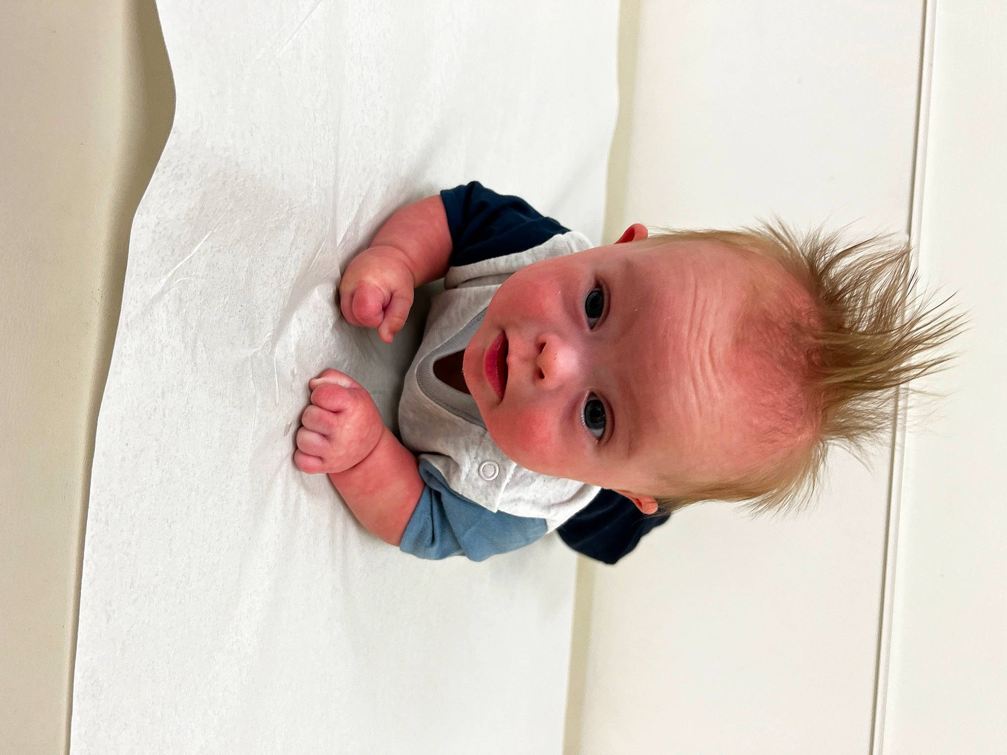 Leland is registered to the contest to win money with this photo: baby, baby_products, baby_toddler_clothing, child, collar, comfort, eyelash, gesture, happy, linens, pattern, person, portrait_photography, room, skin, sleeve, textile, toddler