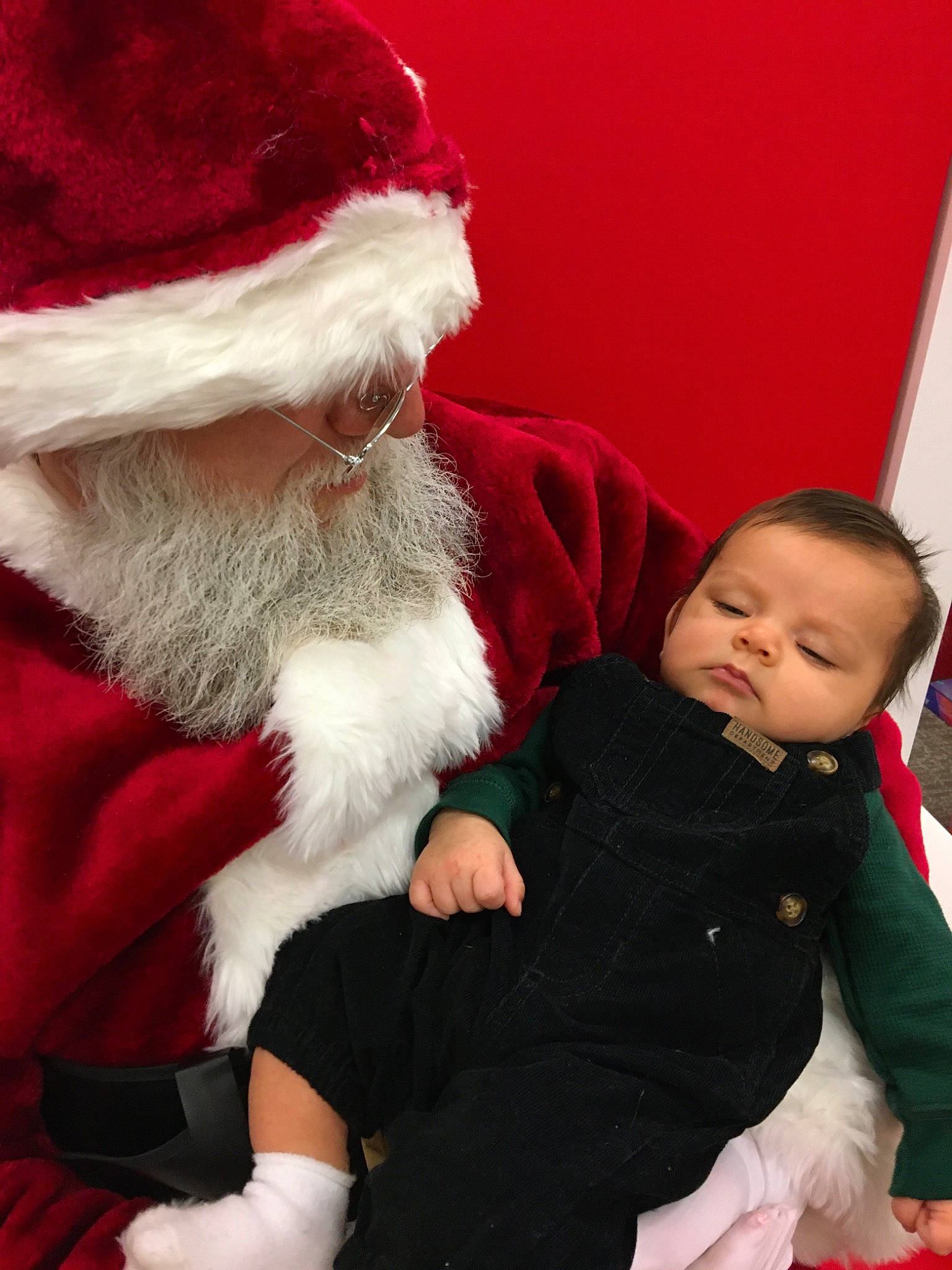 Jasiah joined the competition — help win amazing prizes! beard, child, christmas, christmas_eve, facial_hair, fictional_character, fur, fur_clothing, headwear, holiday, human_body, lap, person, red, santa_claus, toddler