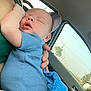 Oaklan joined the competition — help win amazing prizes! baby, newborn, sleeping, blue_onesie, blanket, car_interior, adult_hand, window, seat, comfort, peaceful, child, infant, human, portrait, skin, relaxation, casual, closeup, cozy