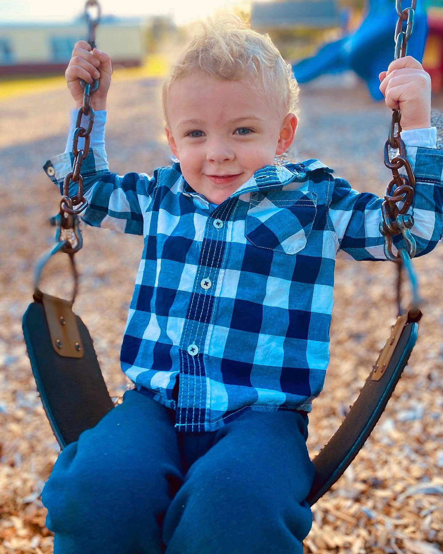 Benjamin is registered to the contest to win money with this photo: azure, baby_toddler_clothing, blue, clothing, facial_expression, fashion, fun, hairstyle, happy, jeans, joy, outerwear, person, photograph, shoulder, sleeve, smile, standing, swing, tartan
