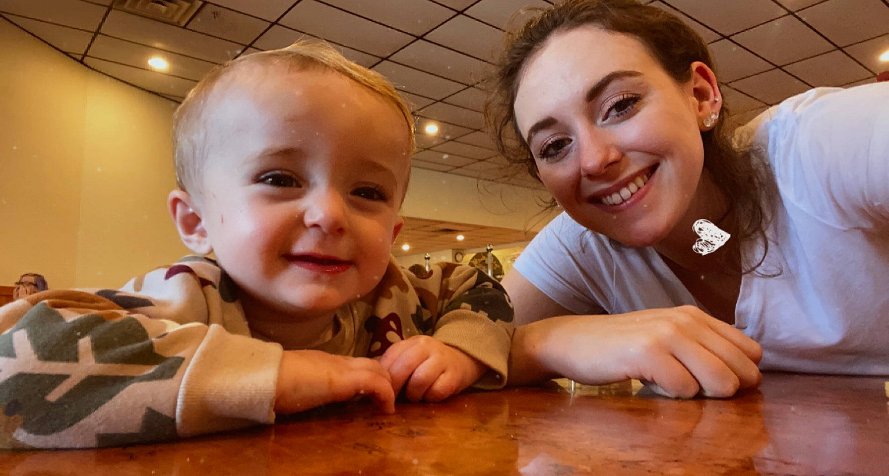 Nikolas joined the competition — help win amazing prizes! baby, cheek, facial_expression, finger, flooring, fun, gesture, hairstyle, hand, happy, hardwood, iris, joy, leisure, mouth, person, skin, smile, table, thumb