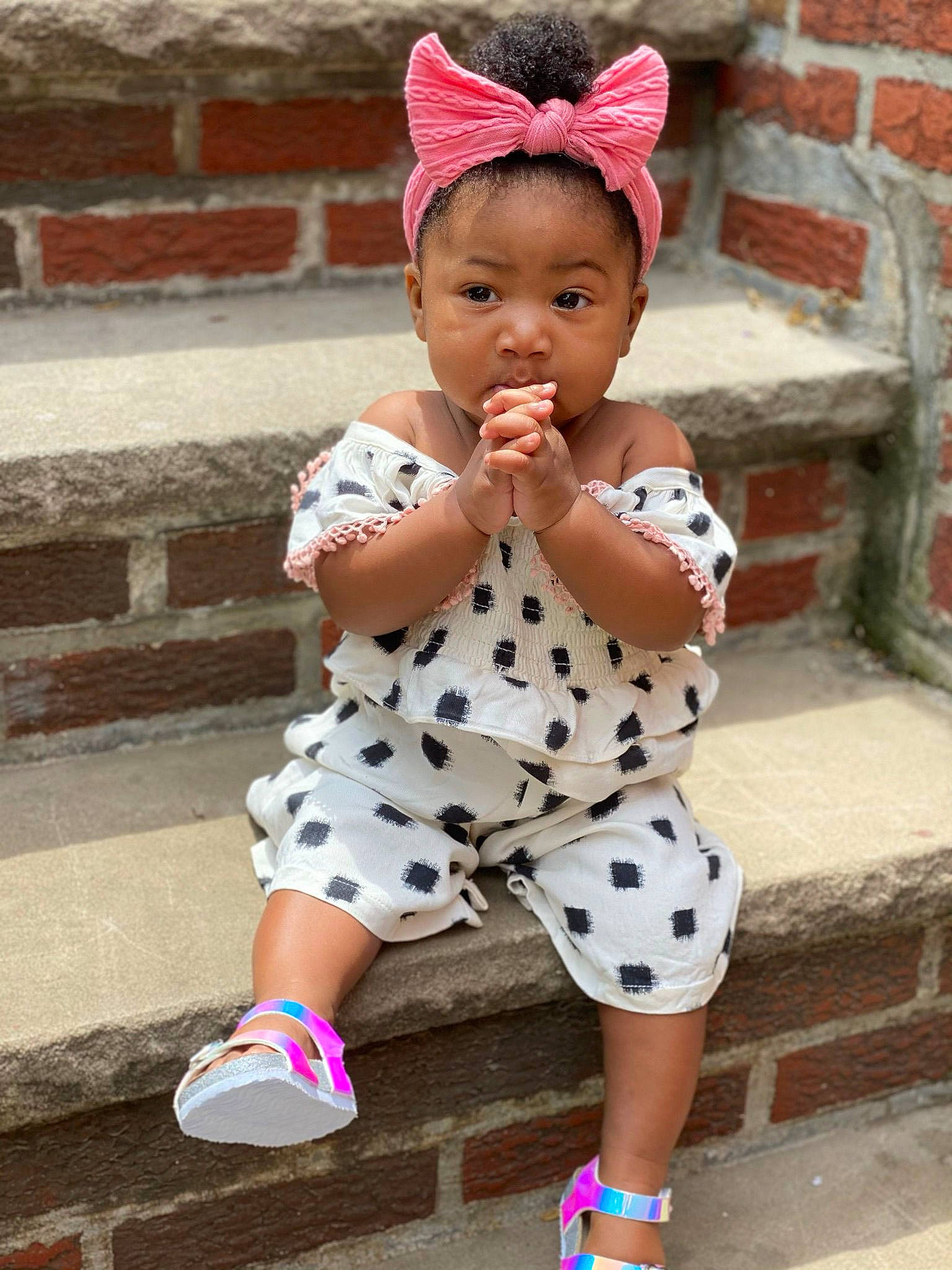 Milan is registered to the contest to win money with this photo: baby, baby_toddler_clothing, cap, child, cool, eye, happy, headgear, human_leg, leg, person, pink, red, shoe, sleeve, sneakers, standing, street_fashion, thigh, toddler