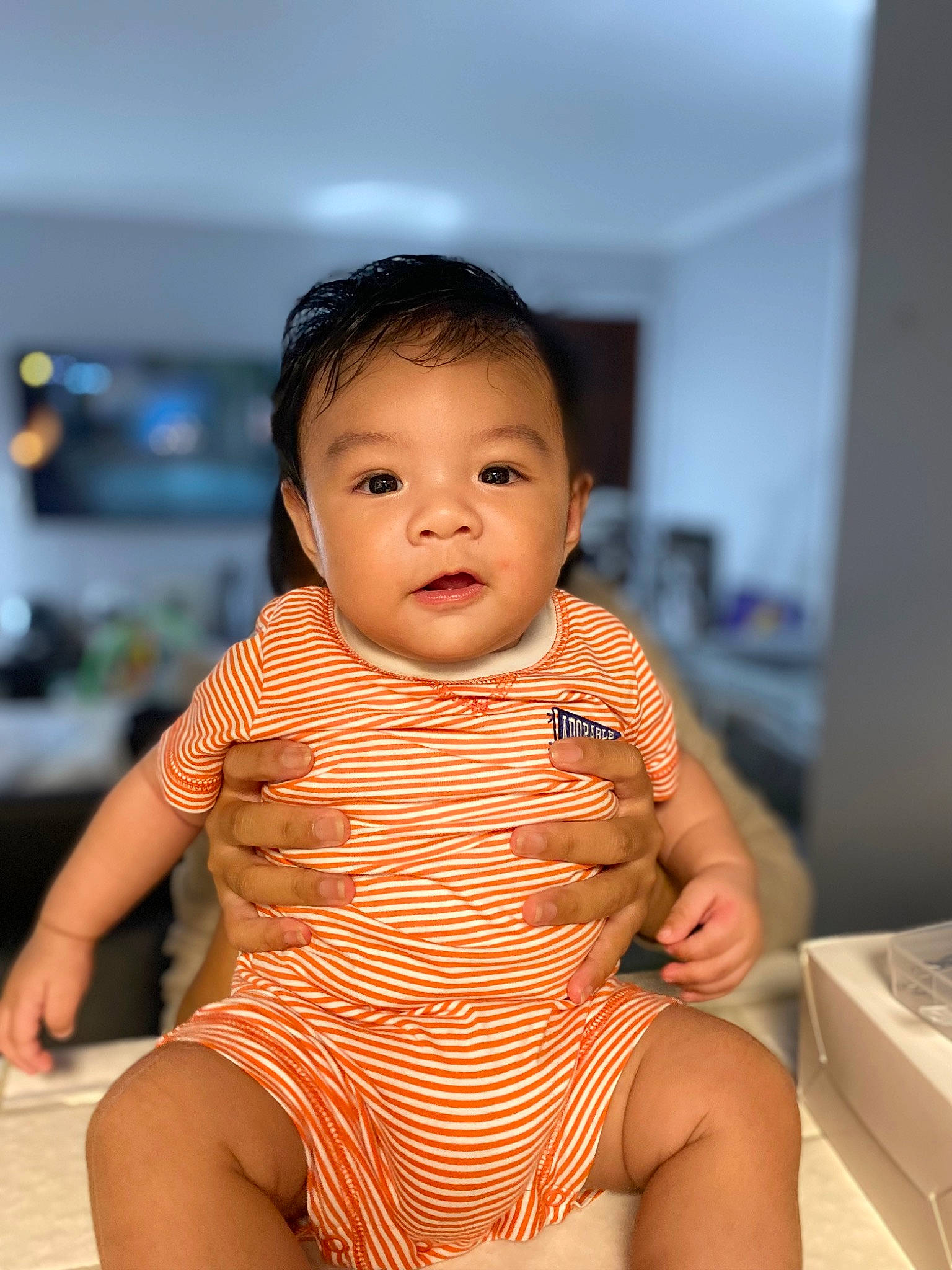 Jace Kai is registered to the contest to win money with this photo: baby_toddler_clothing, black_hair, cheek, elbow, face, finger, flash_photography, gesture, happy, human_body, joint, lip, neck, person, shoulder, skin, sleeve, thigh, thumb, toddler