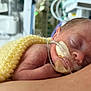 newborn, baby, sleeping, blanket, hospital, medical_equipment, tube, premature, infant, person, skin, arm, closeup, resting, care, healthcare, fragile, cute, small, tender