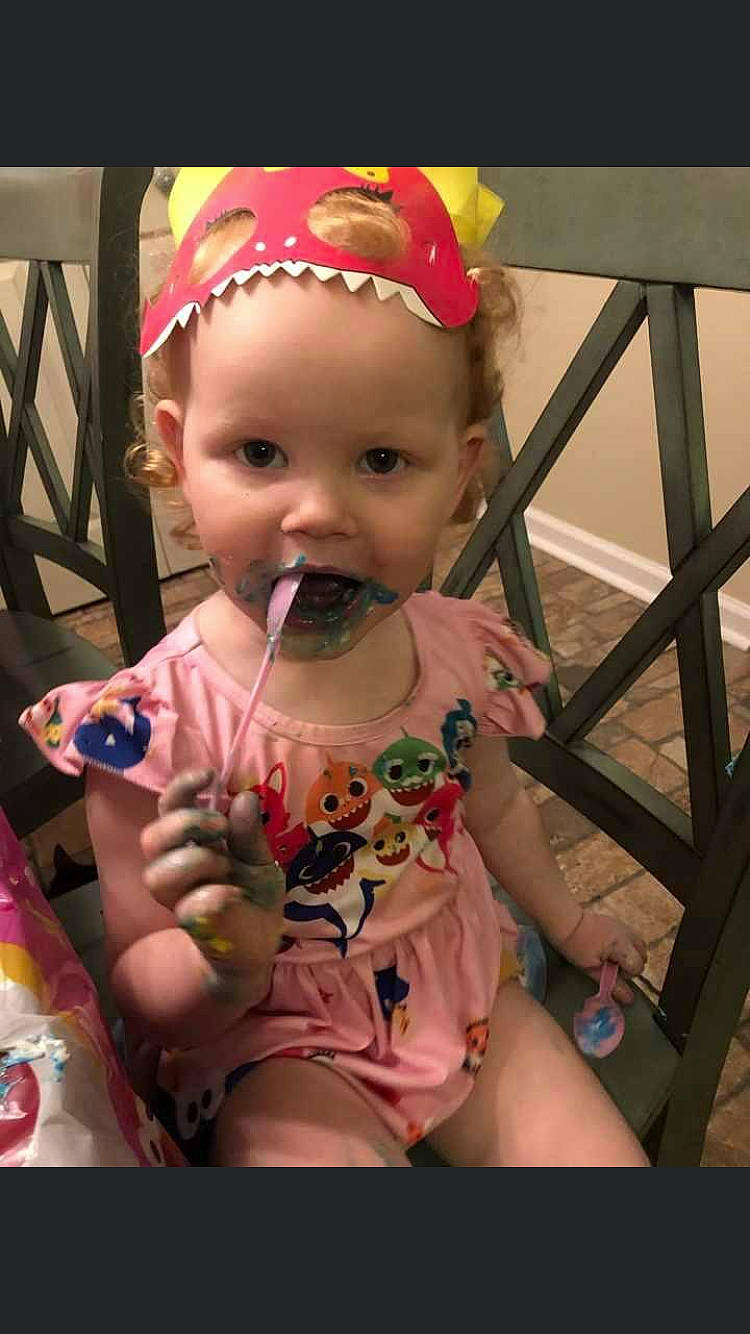 Kynsley is registered to the contest to win money with this photo: baby, baby_products, baby_toddler_clothing, cap, carmine, cheek, child, costume_hat, fun, goggles, happy, headwear, lip, magenta, party_hat, pattern, person, pink, sitting, skin