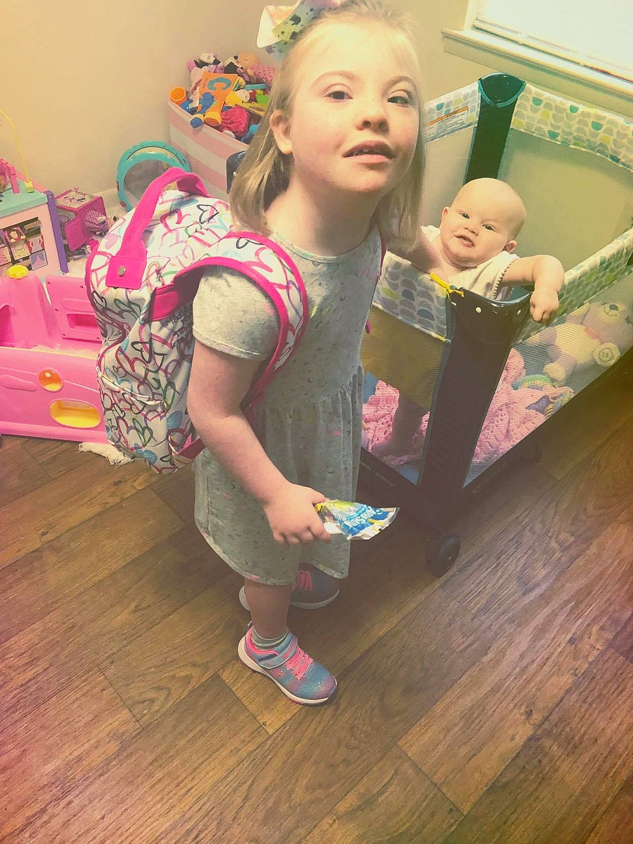 Madisyn joined the competition — help win amazing prizes! baby, child, event, eye, face, floor, flooring, fun, happy, hardwood, head, leisure, magenta, person, pink, room, sandal, sitting, toddler, wood