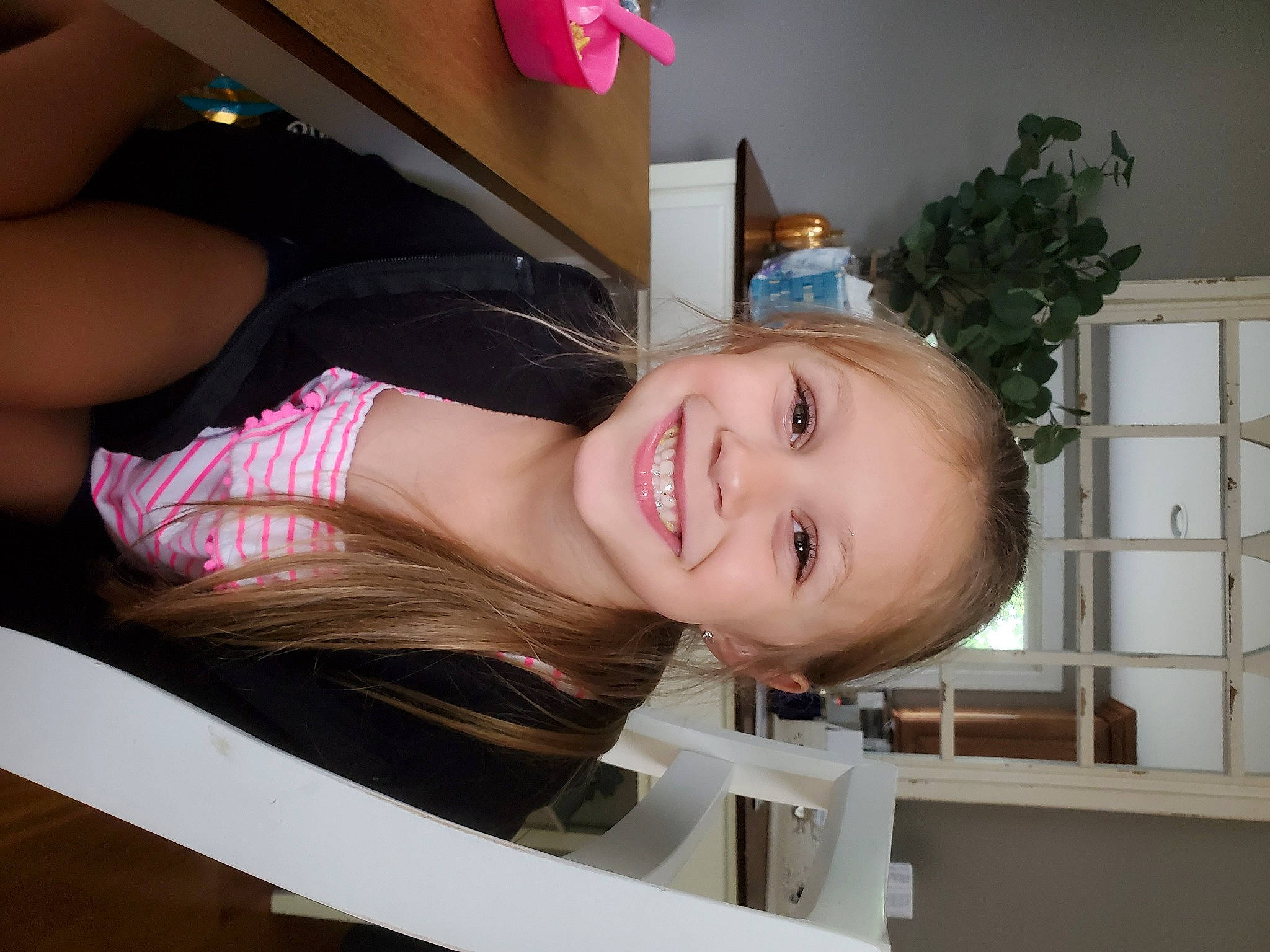 Mckenzie is registered to the contest to win money with this photo: black_hair, chest, child, eyelash, finger, joy, lip, long_hair, mouth, neck, person, photography, pink, selfie, skin, throat, toddler