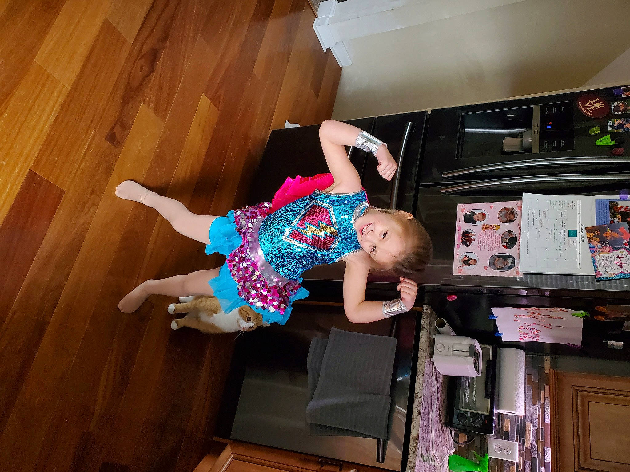 Mckenzie is registered to the contest to win money with this photo: child, electronic_device, floor, flooring, fun, hardwood, joy, leg, person, play, room, technology, toddler, wood