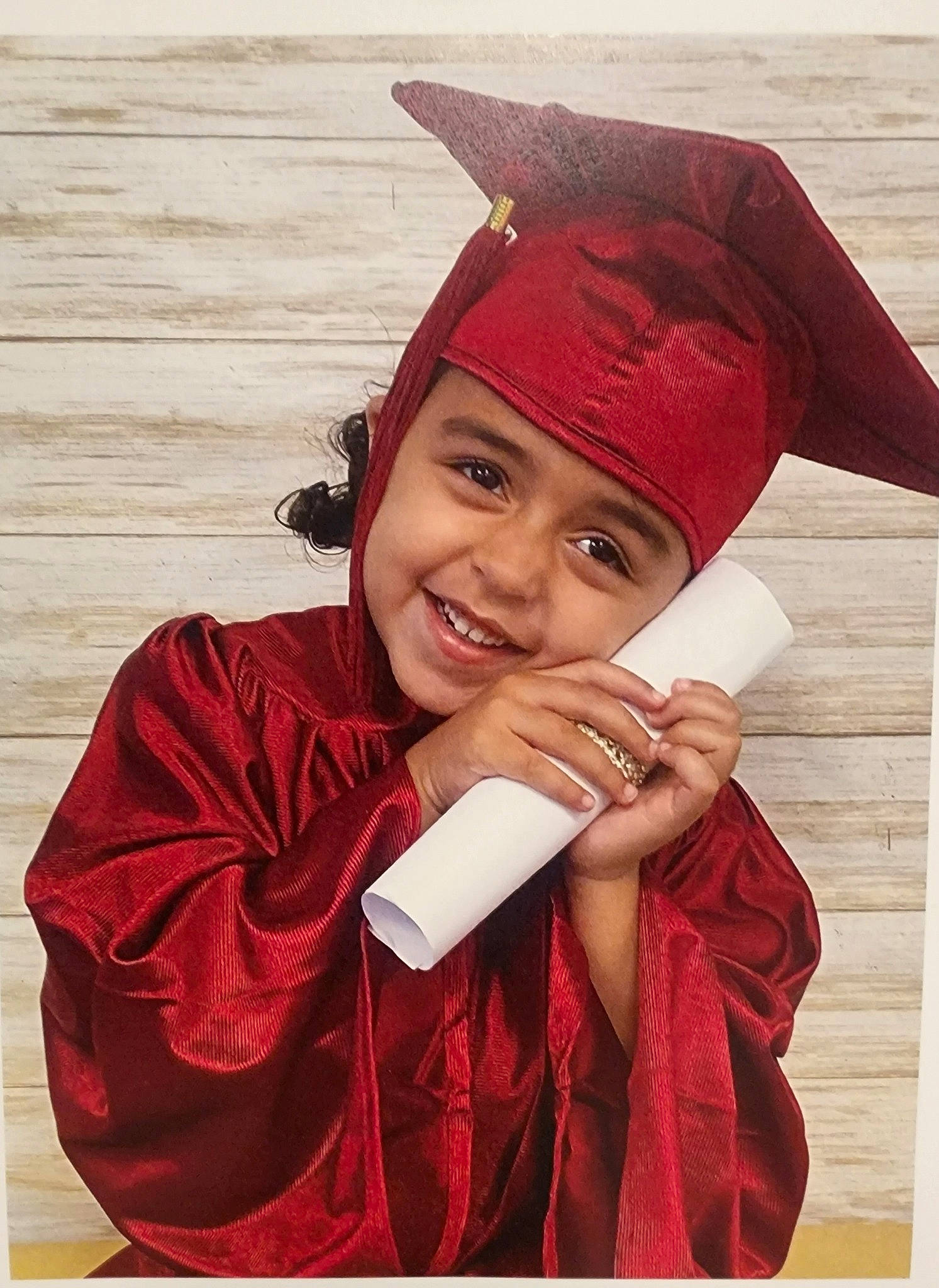 Marie joined the competition — help win amazing prizes! academic_dress, cap, child, collar, costume_hat, event, eye, fashion_accessory, fashion_design, formal_wear, fun, gesture, happy, hat, headgear, headwear, joy, magenta, outerwear, person