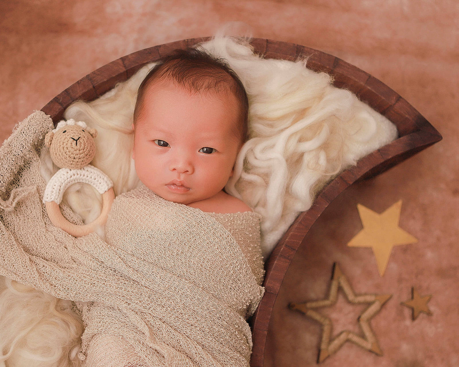 Kian is registered to the contest to win money with this photo: baby, baby_toddler_clothing, cheek, comfort, doll, eye, eyelash, face, head, headgear, iris, linens, lip, nose, person, skin, sleeve, textile, toddler, wood