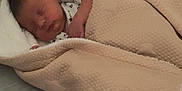 Myles joined the competition — help win amazing prizes! baby, bed, blanket, child, comfort, cozy, cute, face, head, indoors, infant, newborn, peaceful, person, rest, sleeping, soft, toddler, warm, wrapped