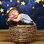 baby, basket, bear_hat, blue_background, child, cozy, cute, fur, hat, infant, knitted, newborn, peaceful, portrait, props, resting, sleeping, starry_background, stars, wooden_floor