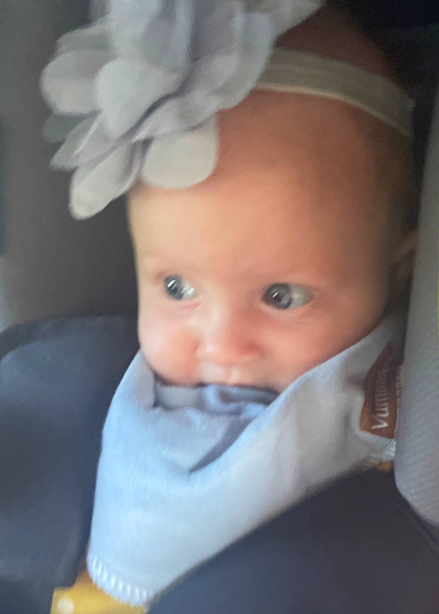 Emmy is registered to the contest to win money with this photo: baby, baby_toddler_clothing, cap, cheek, chin, costume_hat, eye, eyebrow, eyelash, hand, hat, headband, headgear, helmet, iris, lip, person, petal, sleeve, textile