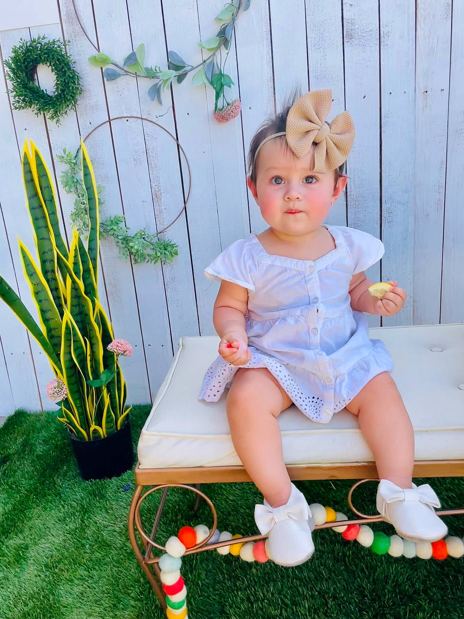 Marlie joined the competition — help win amazing prizes! arm, baby_toddler_clothing, chair, child, dress, foot, grass, headwear, human_leg, knee, leg, leisure, person, plant, sandal, shoe, sitting, sock, terrestrial_plant, thigh