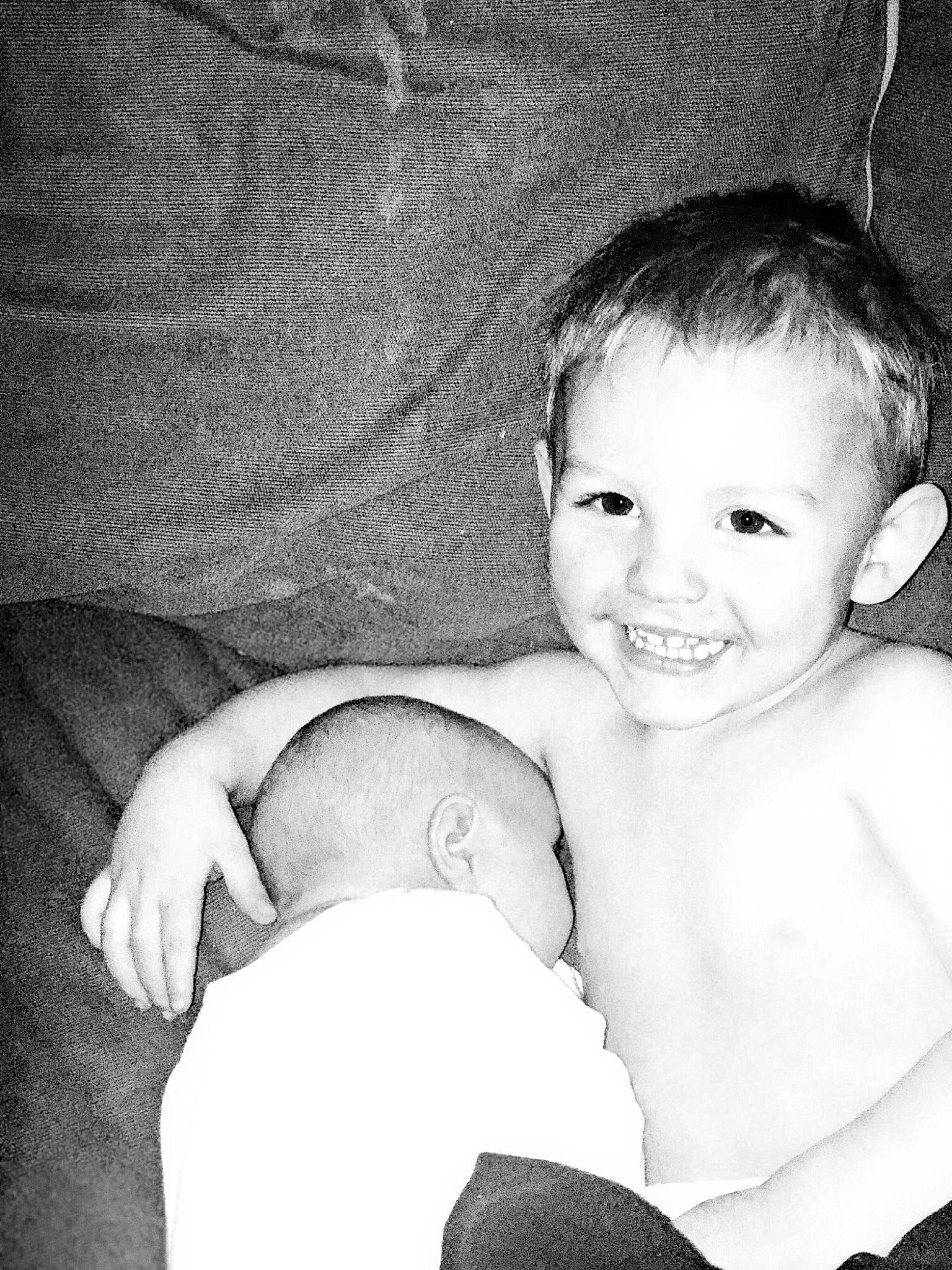 Ryker is registered to the contest to win money with this photo: arm, baby, black, black_and_white, cheek, child, eye, hand, joy, leg, monochrome, monochrome_photography, person, photograph, photography, portrait, skin, smile, snapshot, stock_photography