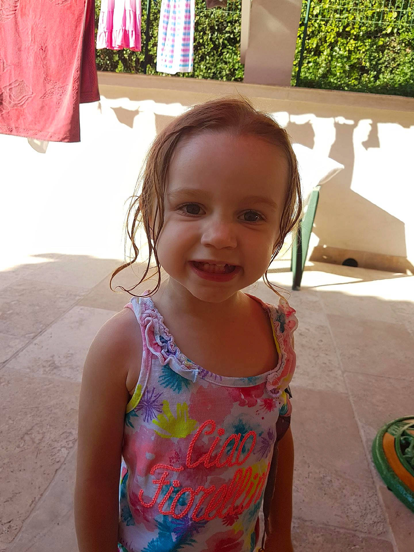 Clémence participe au concours pour gagner de l'argent avec cette photo : child, day, fun, girl, hair, hairstyle, human_hair_color, infant, joy, neck, person, pink, skin, smile, summer, textile, toddler, trunk, vacation