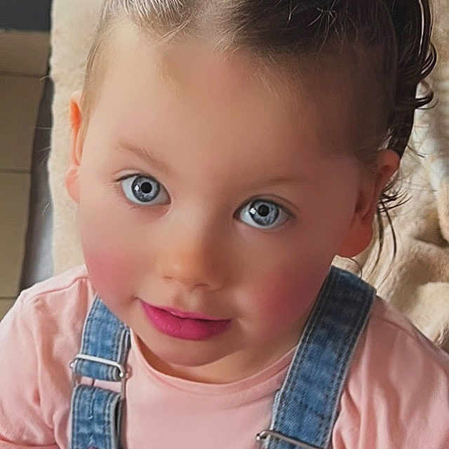 Ruby participe au concours pour gagner de l'argent avec cette photo : accessories, baby, clothing, coat, cosmetics, doll, face, hair, happy, head, jacket, jeans, lipstick, pants, person, photography, portrait, skin, smile, toy