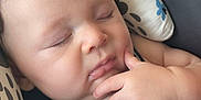 Juhsiya joined the competition — help win amazing prizes! baby, sleeping, car_seat, child, infant, hand, face, cushion, warning_label, safety_harness, closeup, peaceful, cute, child_protection, soft_lighting, indoors, resting, portrait, newborn, comfort