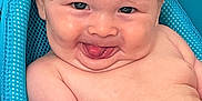 Juhsiya joined the competition — help win amazing prizes! baby, infant, bath, water, blue_bath_seat, wet_hair, tongue_out, smile, cheeky, skin, red_bracelet, cute, playful, child, person, indoors, closeup, expression, funny_face, happy