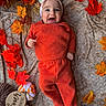 baby, infant, child, smiling, happy, portrait, autumn, fall, leaves, pumpkin, milestone, four_months, headband, orange_outfit, blanket, lying_down, indoor, seasonal, plush_toy, family_photo