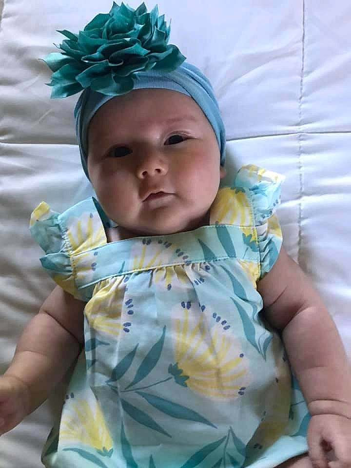 Lillie joined the competition — help win amazing prizes! azure, baby, baby_products, baby_sleeping, baby_toddler_clothing, blue, cheek, child, eye, face, fashion_accessory, finger, grass, happy, head, headgear, headwear, linens, mouth, person
