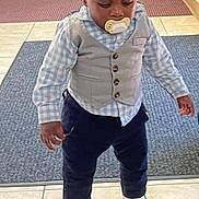 Aziel joined the competition — help win amazing prizes! toddler, child, pacifier, vest, shirt, pants, shoes, flooring, tile, carpet, indoor, person, baby, hair, standing, looking_down, clothing, cute, small_child, casual