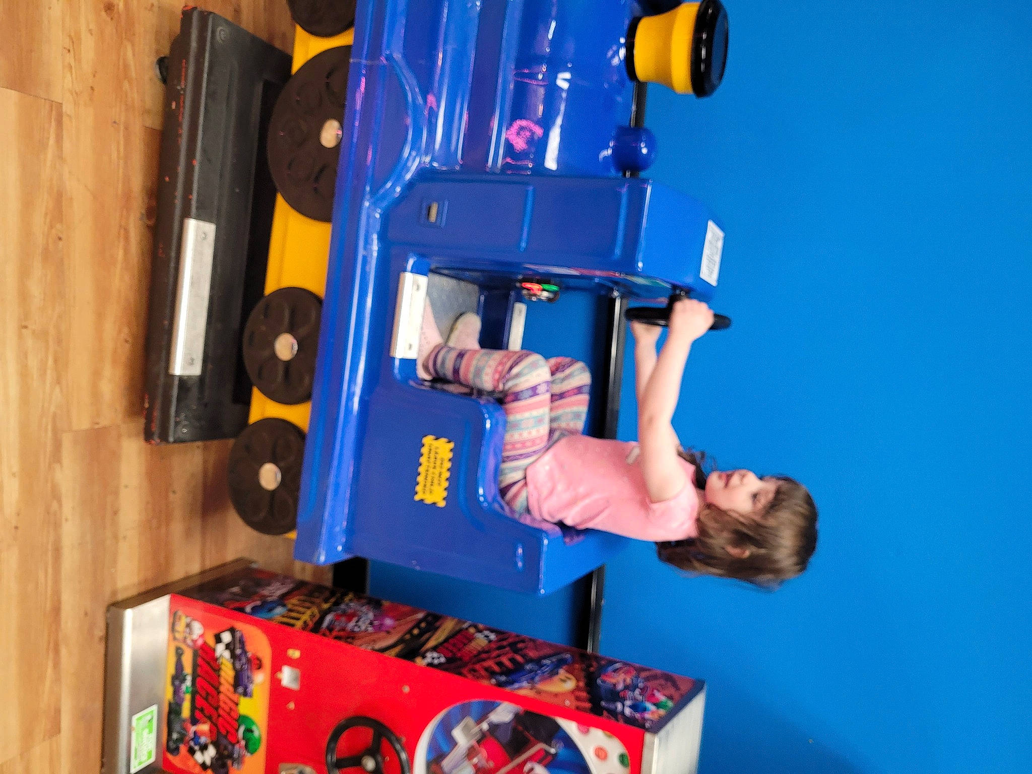 Faylen is registered to the contest to win money with this photo: auto_part, automotive_exterior, balance, blue, car, elbow, electric_blue, engineering, fun, human_leg, leisure, machine, person, plastic, play, recreation, room, shorts, t_shirt, tire