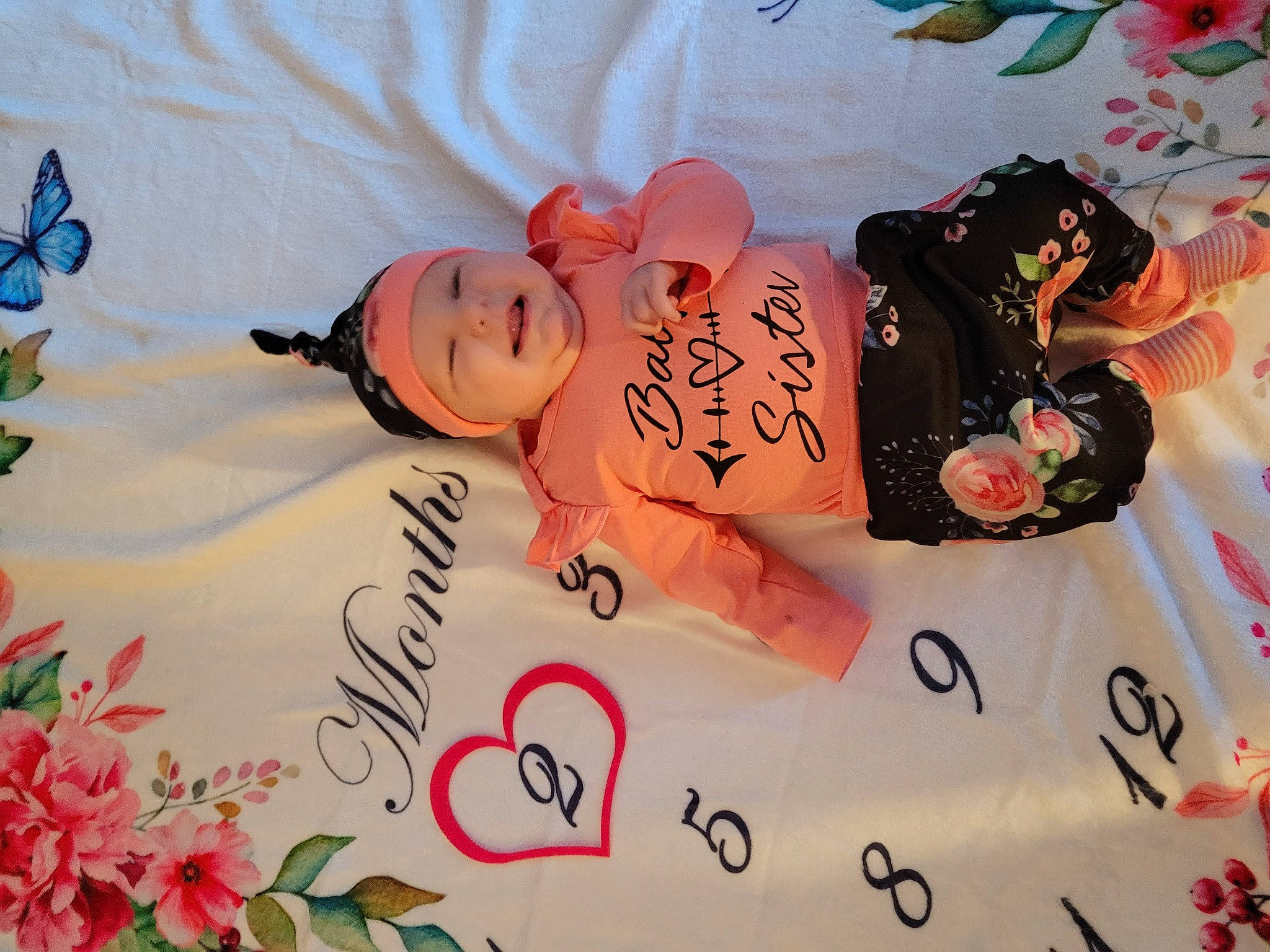 Rynlee joined the competition — help win amazing prizes! art, baby, baby_toddler_clothing, butterfly, child, design, font, happy, headwear, linens, pattern, peach, person, petal, pink, plant, pollinator, product, room, skin