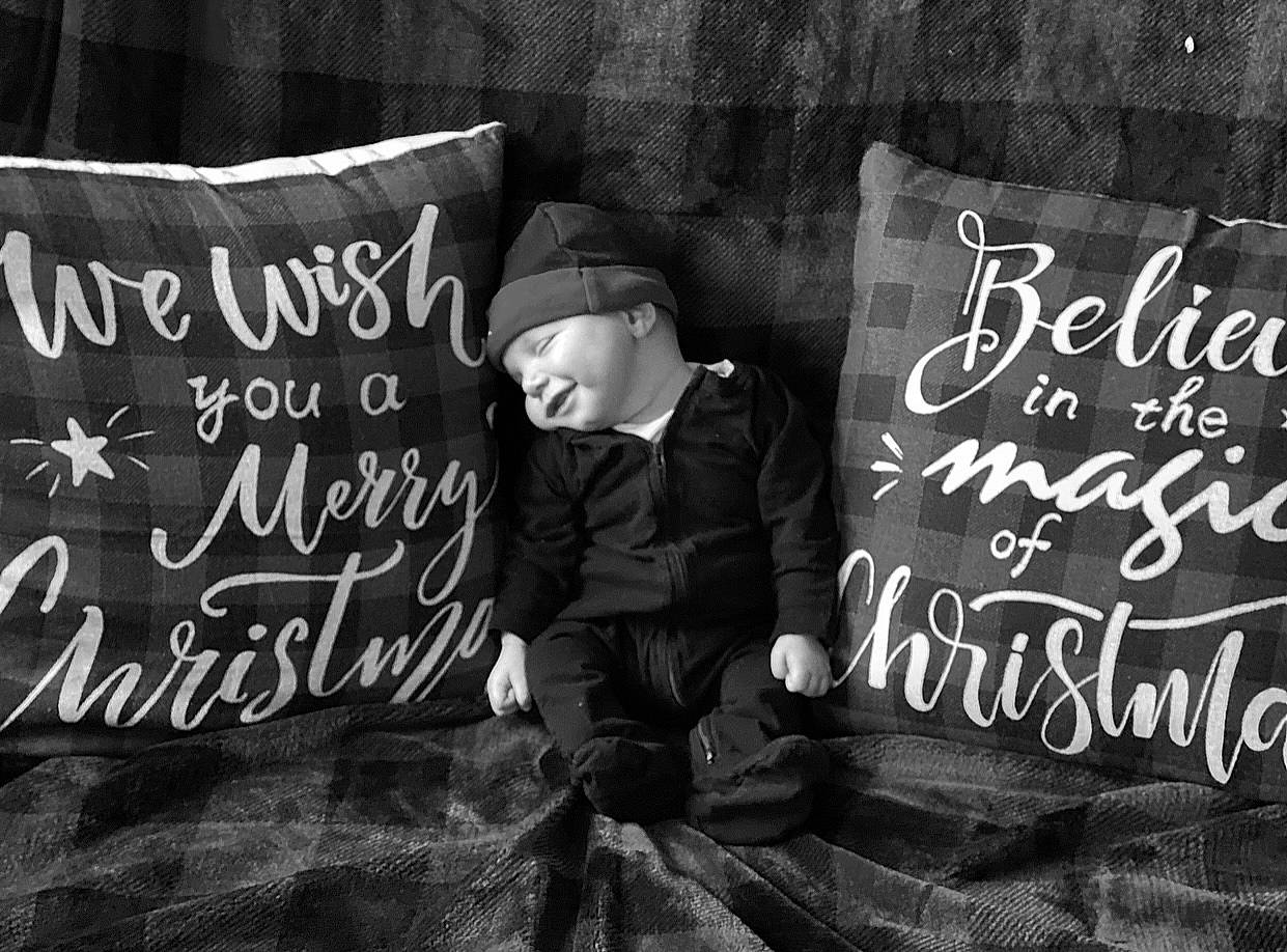 Marco is registered to the contest to win money with this photo: advertising, black, black_and_white, event, font, grass, handwriting, happy, hat, headwear, interaction, monochrome, monochrome_photography, person, photo_caption, photograph, poster, room, sitting, stock_photography