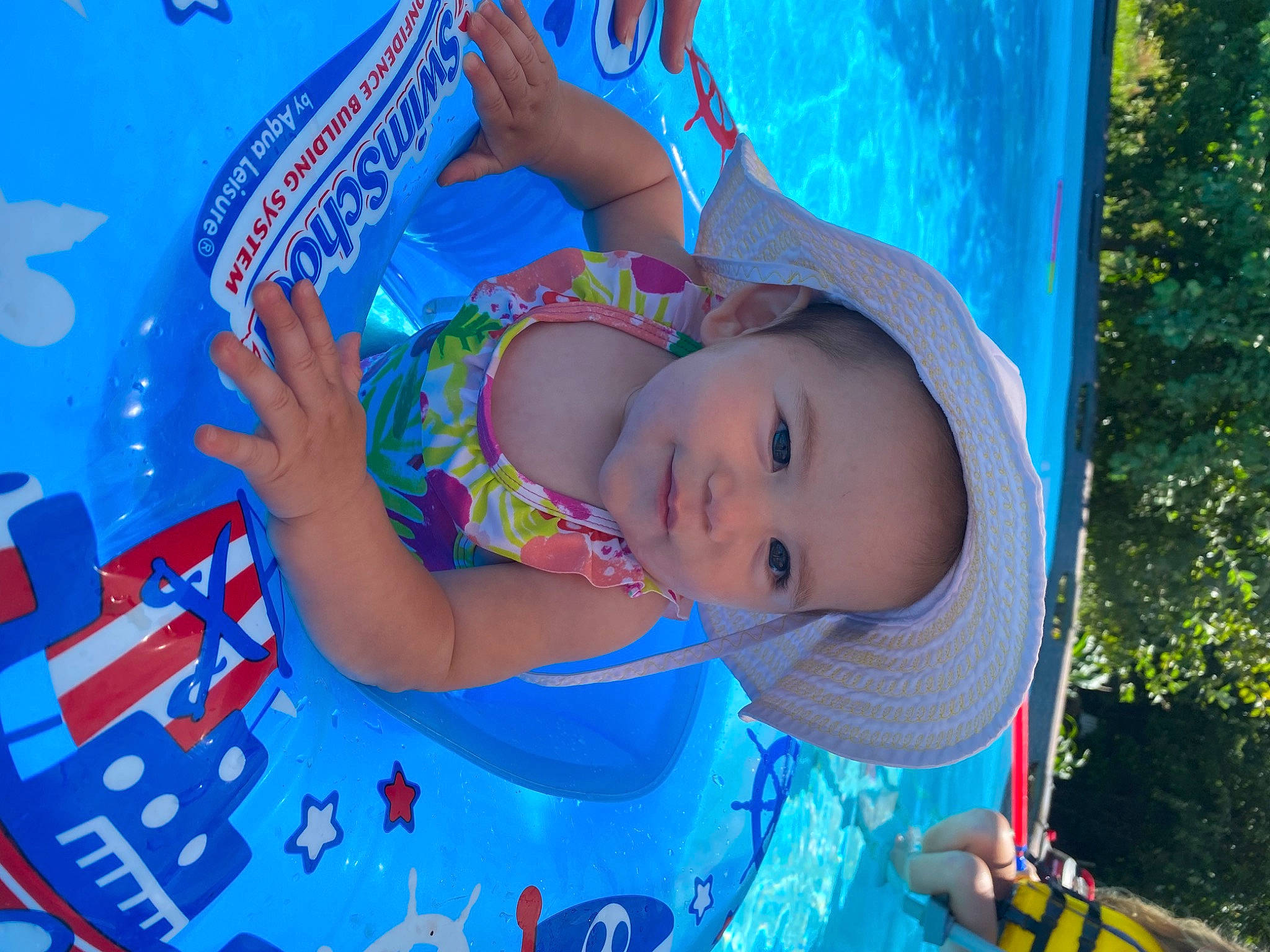 Sapphira joined the competition — help win amazing prizes! aqua, azure, baby, baseball_cap, blue, cap, child, cloud, electric_blue, fun, happy, hat, headgear, leisure, person, recreation, sky, sun_hat, toddler, tree