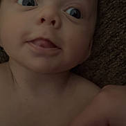 Paxton joined the competition — help win amazing prizes! baby, infant, close_up, face, eyes, hand, towel, skin, person, portrait, expression, curious, young_child, child, indoors, human, head, mouth, wrapping, blanket