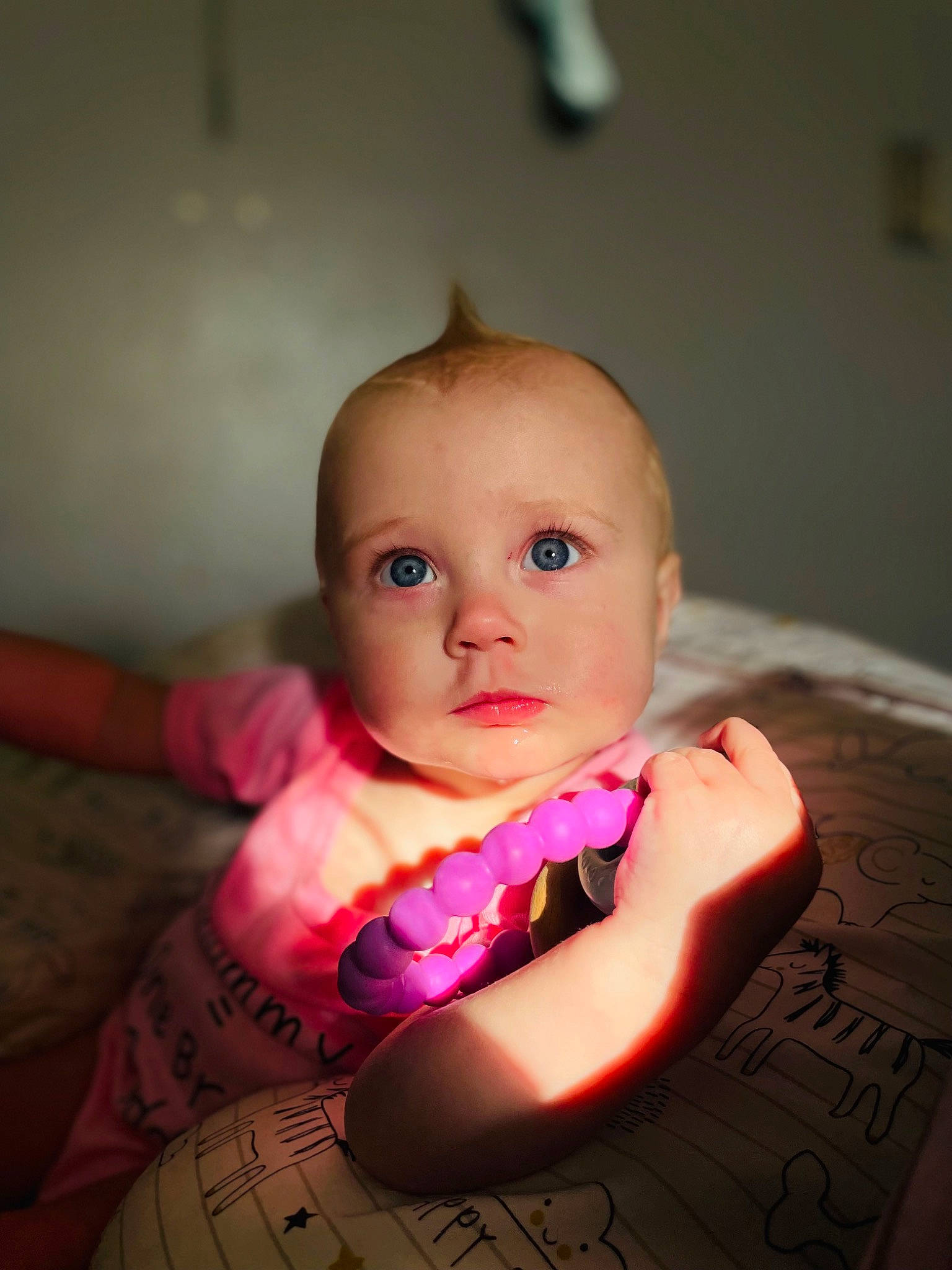 Willow is registered to the contest to win money with this photo: baby, baby_toddler_clothing, cheek, child, comfort, finger, flash_photography, flooring, happy, iris, linens, lip, magenta, mouth, neck, person, pink, sitting, skin, sleeve